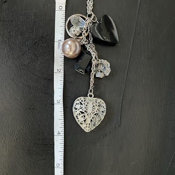 Long silver toned necklace with 8 charms in black and silver heart bead ring - Picture 9 of 9